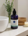 Bayou Breeze Sulfate-Free Hand Soap in blue pump bottle on countertop for sensitive skin