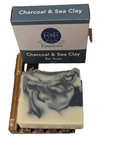 Charcoal & Sea Clay Bar Soap displayed with box and wooden dish, handcrafted for oily and acne-prone skin.