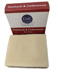 Bar of soap with a red and white box labeled 'Patchouli & Cedarwood' on a white background.