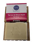 Bar of soap with packaging labeled 'Yarrow & Witch Hazel' on a white background