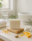 Frankincense bar soap on wooden tray with natural skincare ingredients in a bright bathroom setting