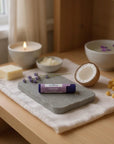 Lavender lip balm with natural ingredients including cocoa butter, coconut oil, beeswax, and lavender essential oil for moisturizing and soothing dry lips