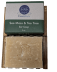 Sea Moss & Tea Tree bar soap on wooden holder, known for natural skincare benefits.