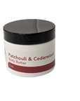Patchouli & Cedarwood Body Butter jar with black lid, providing luxurious hydration for dry skin.