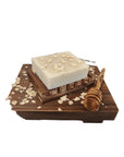 Oatmeal & Honey Bar Soap displayed on a wooden tray with oats and honey dipper.