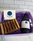 Lemongrass gift basket with soap, hand soap, wooden soap dish, and purple packaging.
