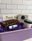 Gift Basket Oatmeal & Honey with self-care essentials in purple storage bin.