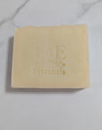 Bar of soap with 'E & E' branding on a marble surface