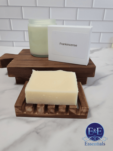 Frankincense soap on wooden tray with candle; organic skincare benefits.