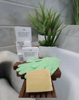 Aloe & Shea Butter Bar Soap next to a towel on a bathroom counter