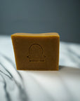 Carrot & Turmeric Bar Soap featuring the product's logo