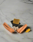 Carrot & Turmeric Bar Soap displayed next to ingredients