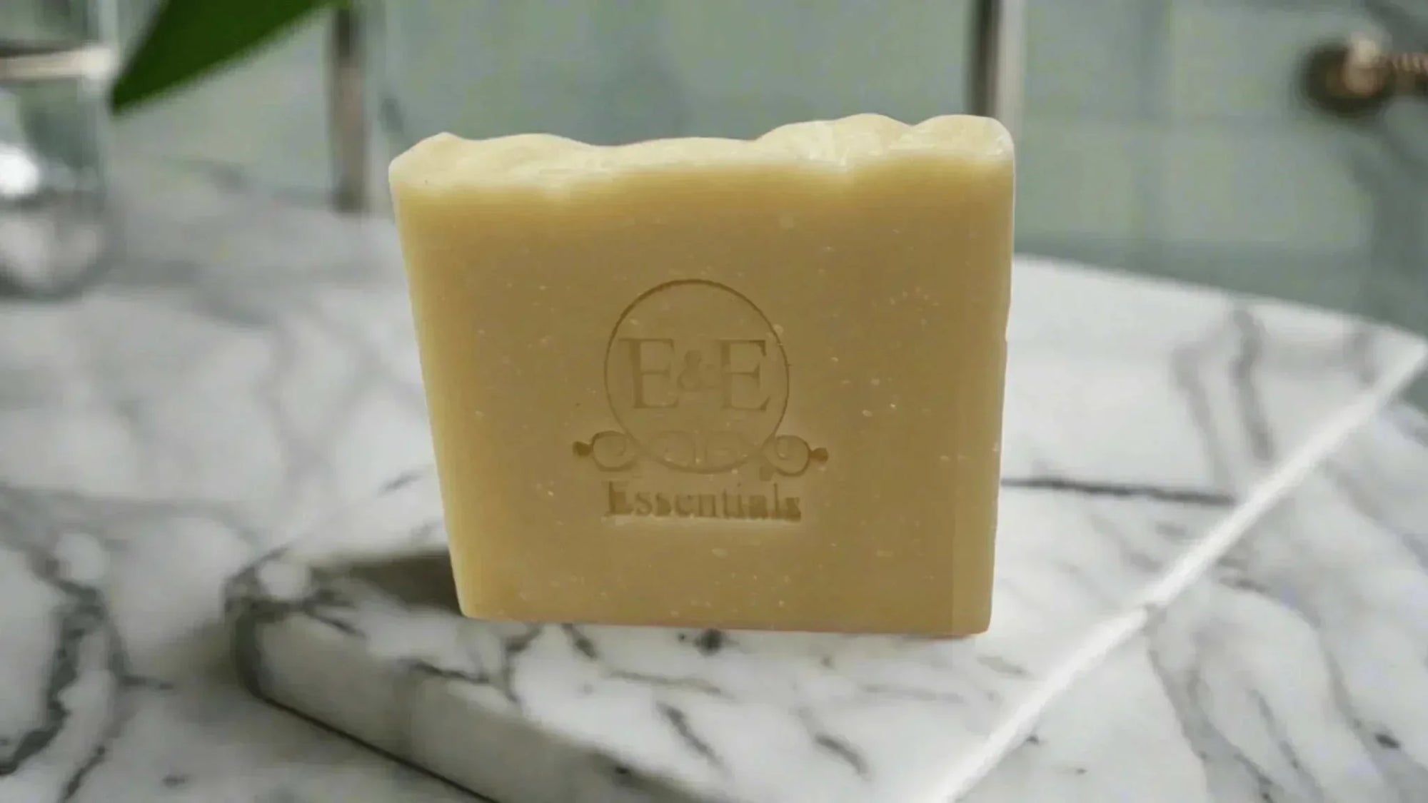 Aloe &amp; Shea Butter Bar Soap on marble counter, ideal for sensitive skin hydration.