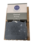 Charcoal bar soap on white background featuring E & E Essentials branding, natural acne solution