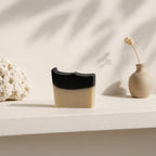 Natural charcoal and sea clay bar soap for deep pore cleansing and skin detoxification, suitable for face and body.