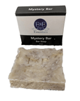 Bar of soap with a packaging box labeled 'Mystery Bar' on a white background