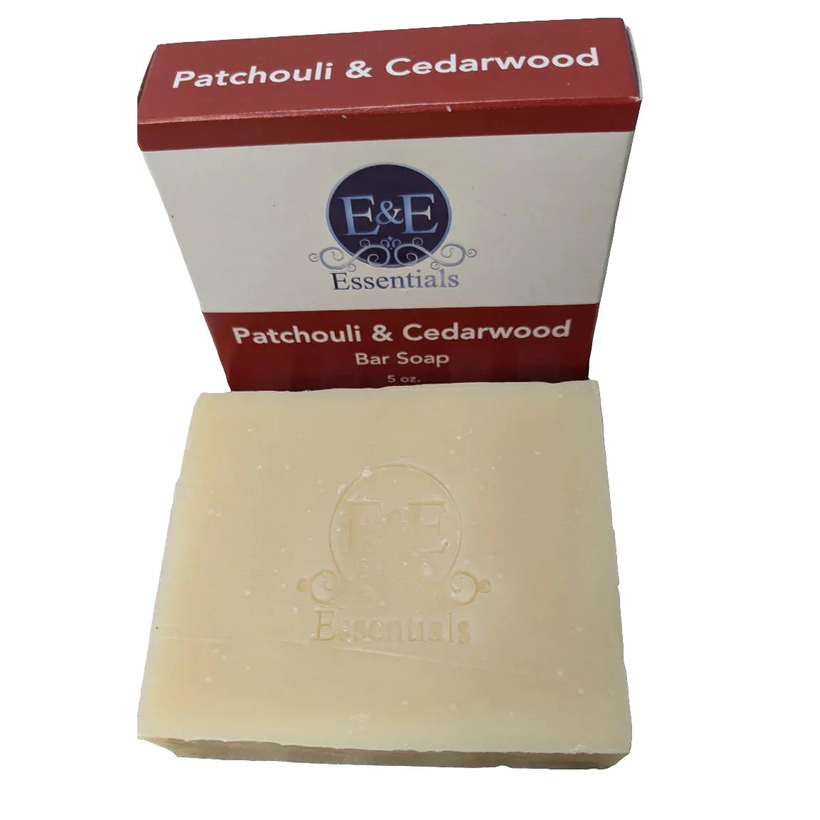 Bar of soap with a red and white box labeled 'Patchouli & Cedarwood' on a white background.