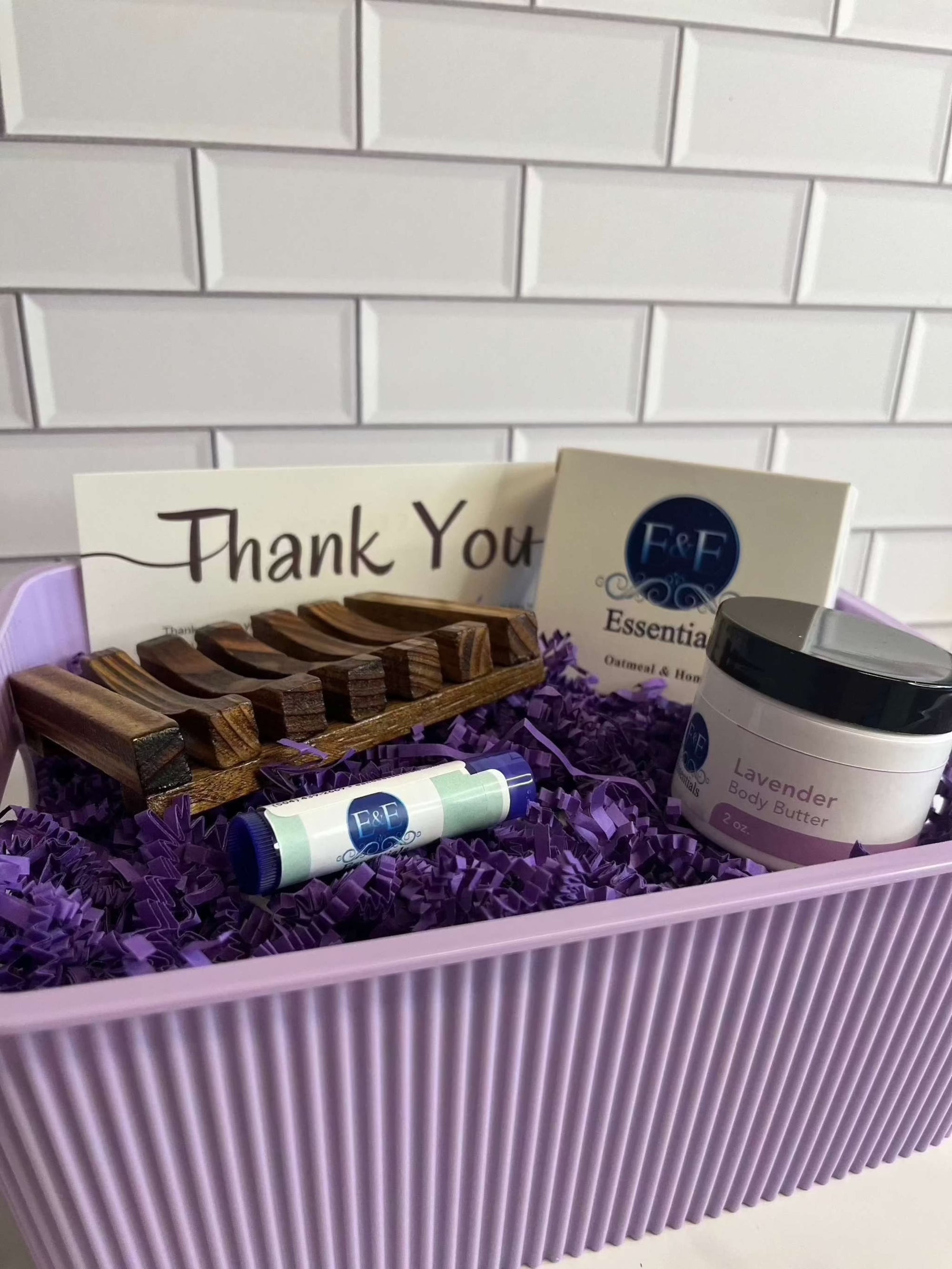 Gift Basket Oatmeal & Honey with self-care essentials in purple storage bin.