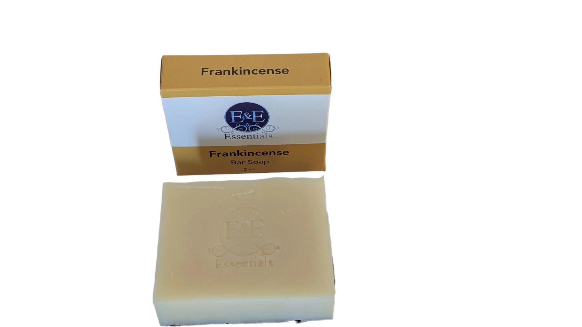 Frankincense bar soap displayed on a rustic wooden dish