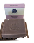 Lavender bar soap displayed on a wooden tray with its packaging box