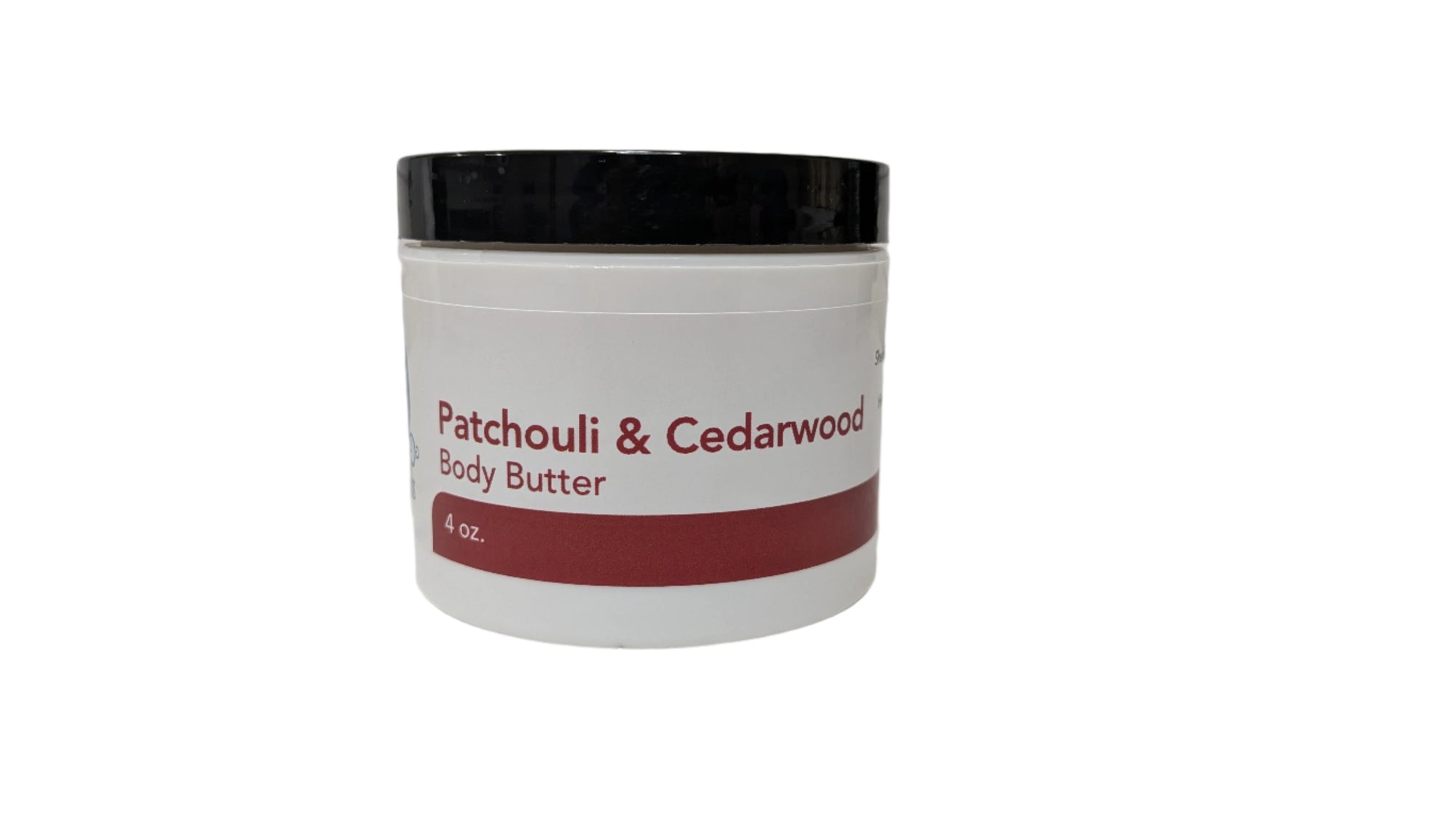 Close-up of Patchouli & Cedarwood Body Butter in a glass jar