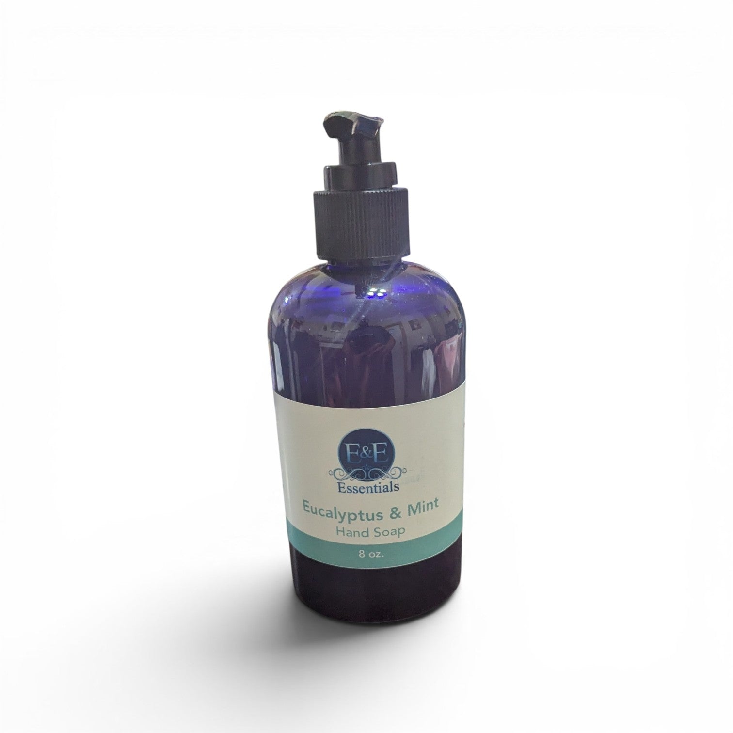 Bottle of Eucalyptus &amp; Mint hand soap on a white background