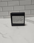 Patchouli Moisturizing Bar Soap in black container, vegan hydrating formula by E & E Essentials