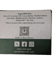 Sea Moss & Tea Tree Bar Soap packaging with ingredients list and contact information.