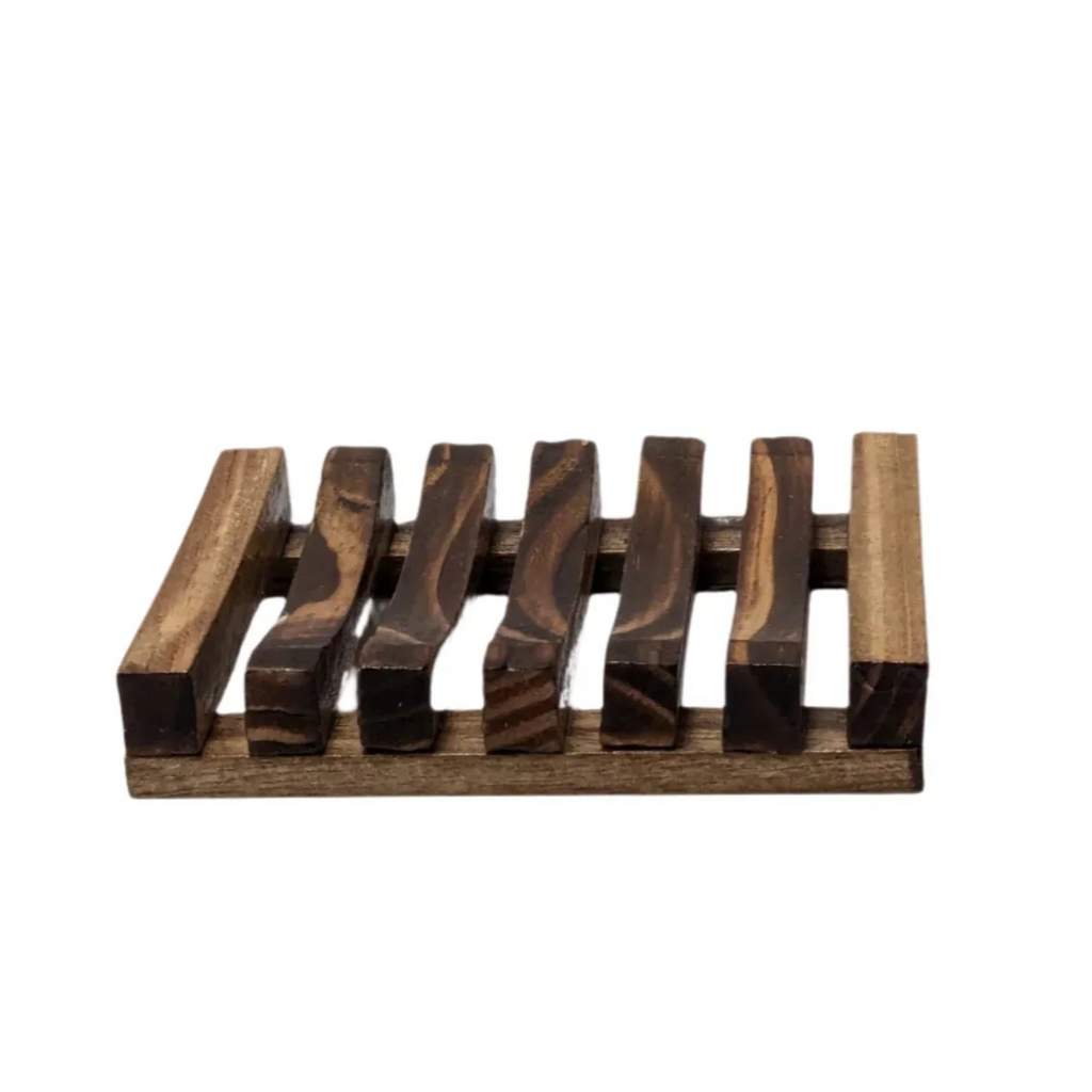 Wooden soap dish with a slatted design, ideal for keeping soap dry and lasting longer.
