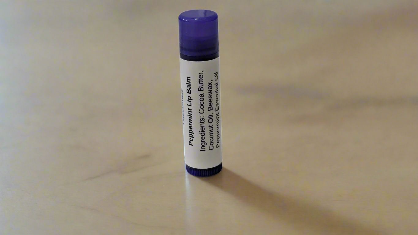 A single Peppermint Lip Balm tube with a purple label