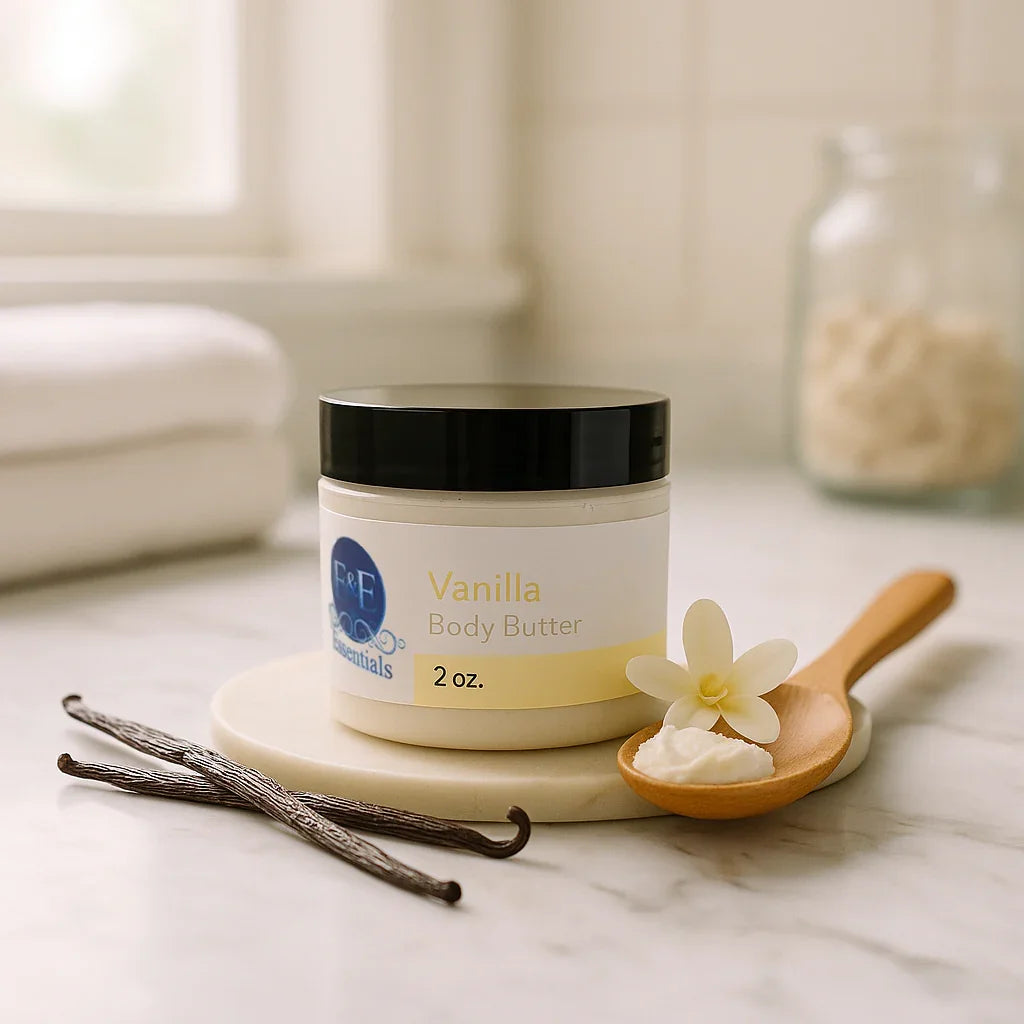2 oz jar of whipped vanilla body butter cream with vanilla pods and flower on marble countertop for deep hydration and sensitive skin care