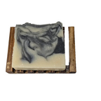 Charcoal & Sea Clay Bar Soap on a wooden soap dish