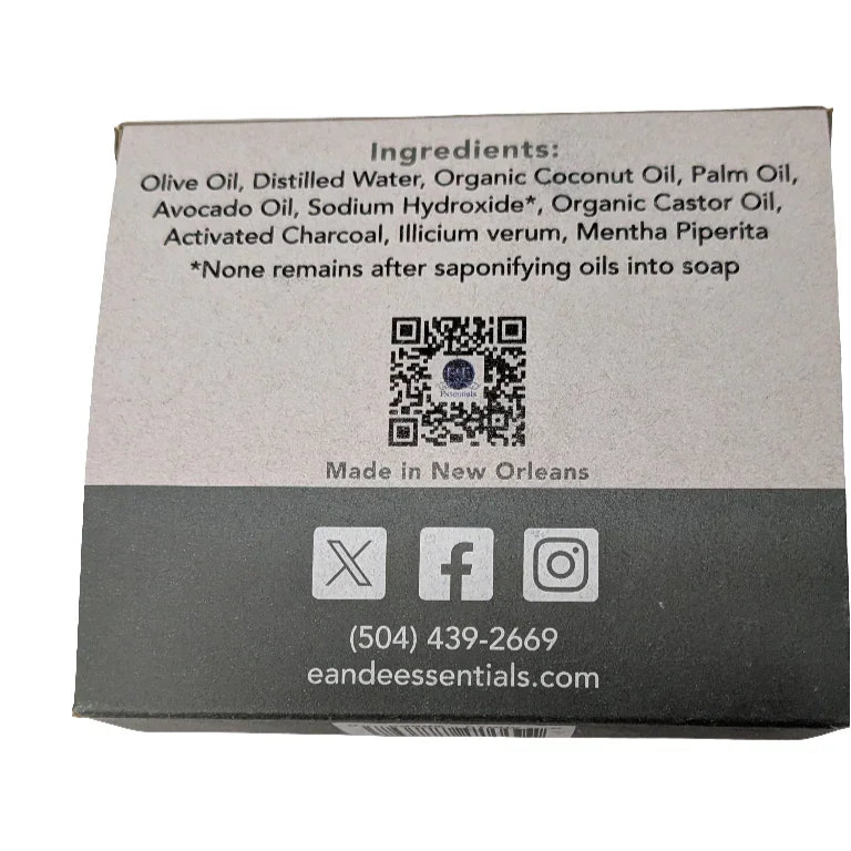 Box of activated charcoal soap with labeled ingredients, showcasing olive oil, coconut oil, palm oil, and activated charcoal.