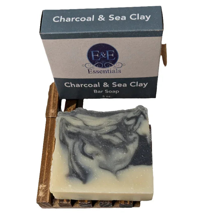 Charcoal & Sea Clay Soap bar on wooden dish with box packaging.