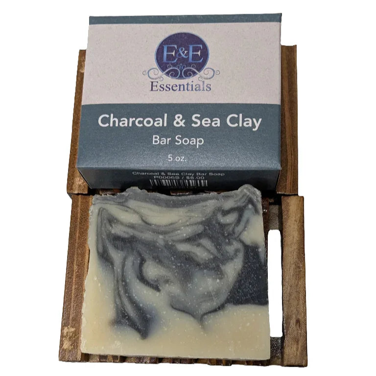 Charcoal and Sea Clay Soap bar on wooden dish for deep cleansing and fresh skin