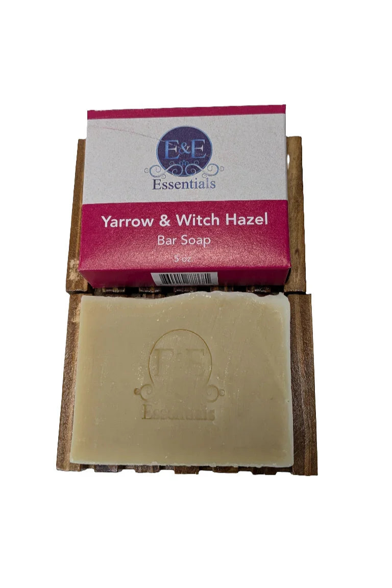 Yarrow & Witch Hazel Facial Soap in packaging on wooden holder.