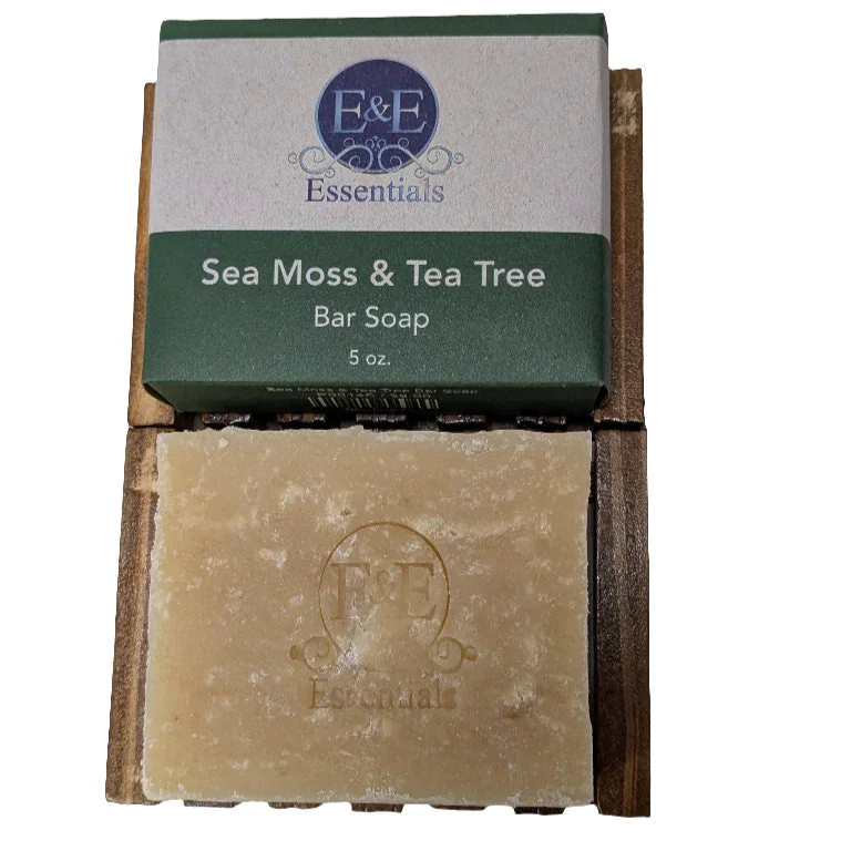 Sea Moss & Tea Tree bar soap on wooden holder, known for natural skincare benefits.