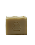 Patchouli & Cedarwood soap bar featuring the product's embossed logo