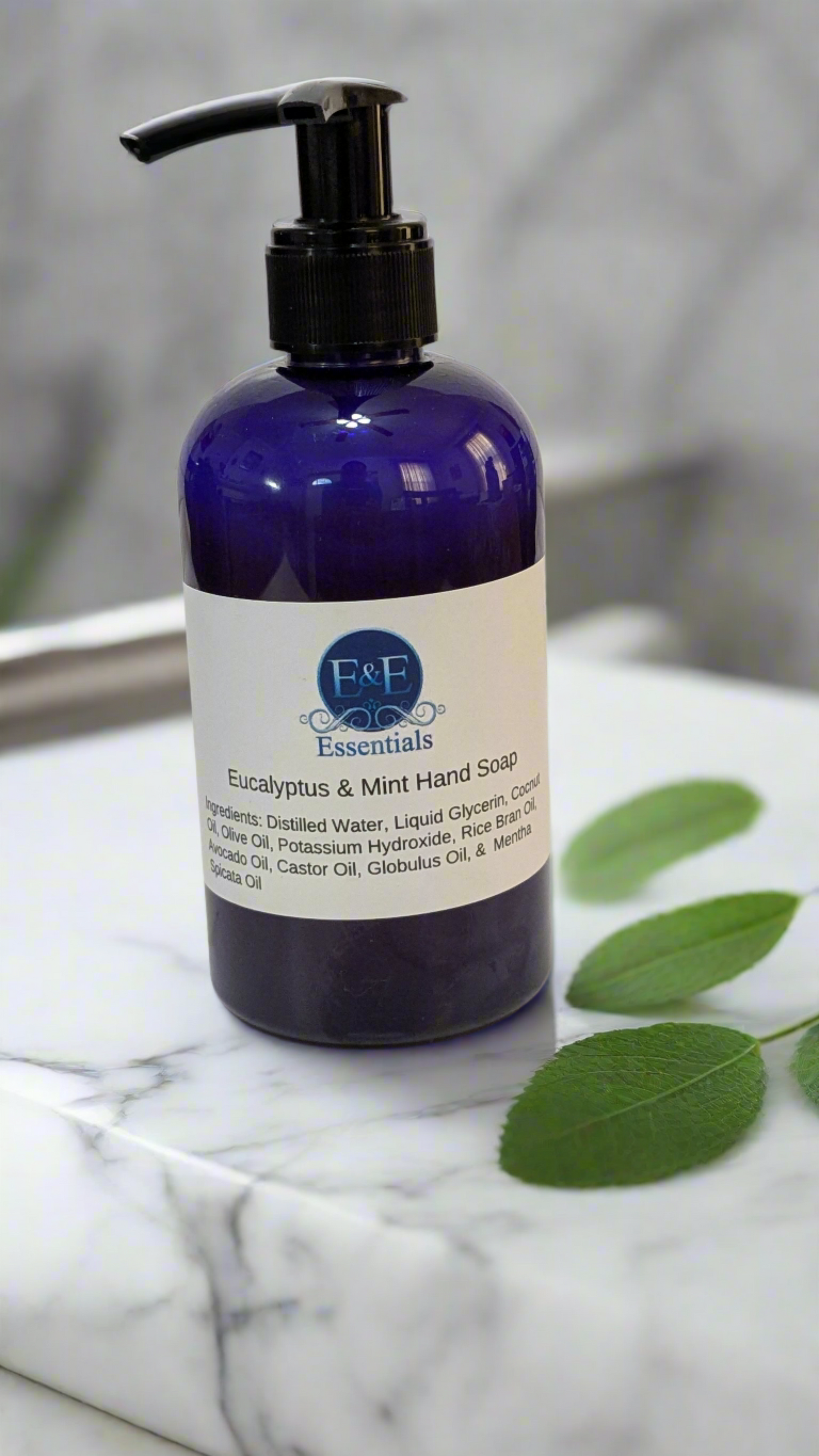 Close-up of Eucalyptus & Mint Hand Soap bottle on a marble countertop