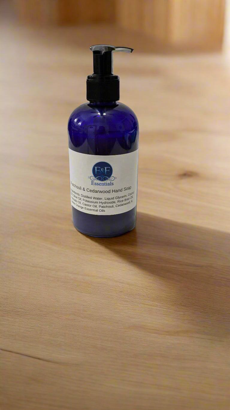 Patchouli & Cedarwood scented liquid hand soap bottle on a marble countertop