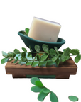 Eucalyptus & Mint Bar Soap on a wooden holder with eucalyptus leaves for decoration