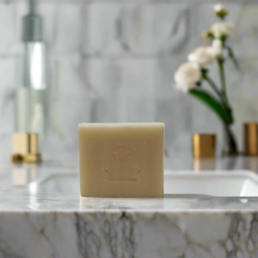 Frankincense bar soap resting atop a bathroom sink