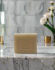 Frankincense bar soap resting atop a bathroom sink