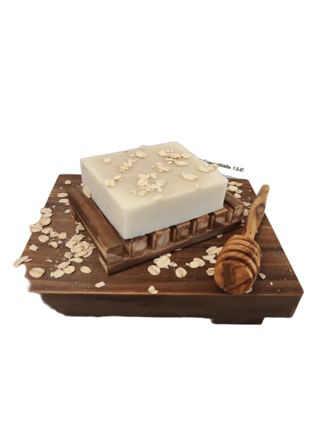 Oatmeal & Honey Bar Soap on wooden tray with oats and honey dipper.