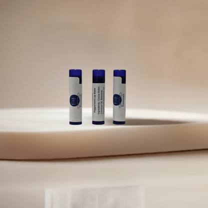 A trio of Peppermint Lip Balms displayed on a white background