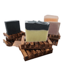 Wooden soap dish with three artisanal soaps, showcasing natural and eco-friendly bathroom decor.