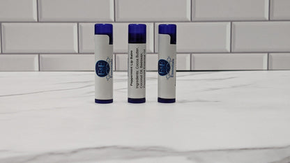 Close-up of Peppermint Lip Balm tubes with purple and white design