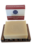 Patchouli & Cedarwood bar soap displayed on a wooden dish