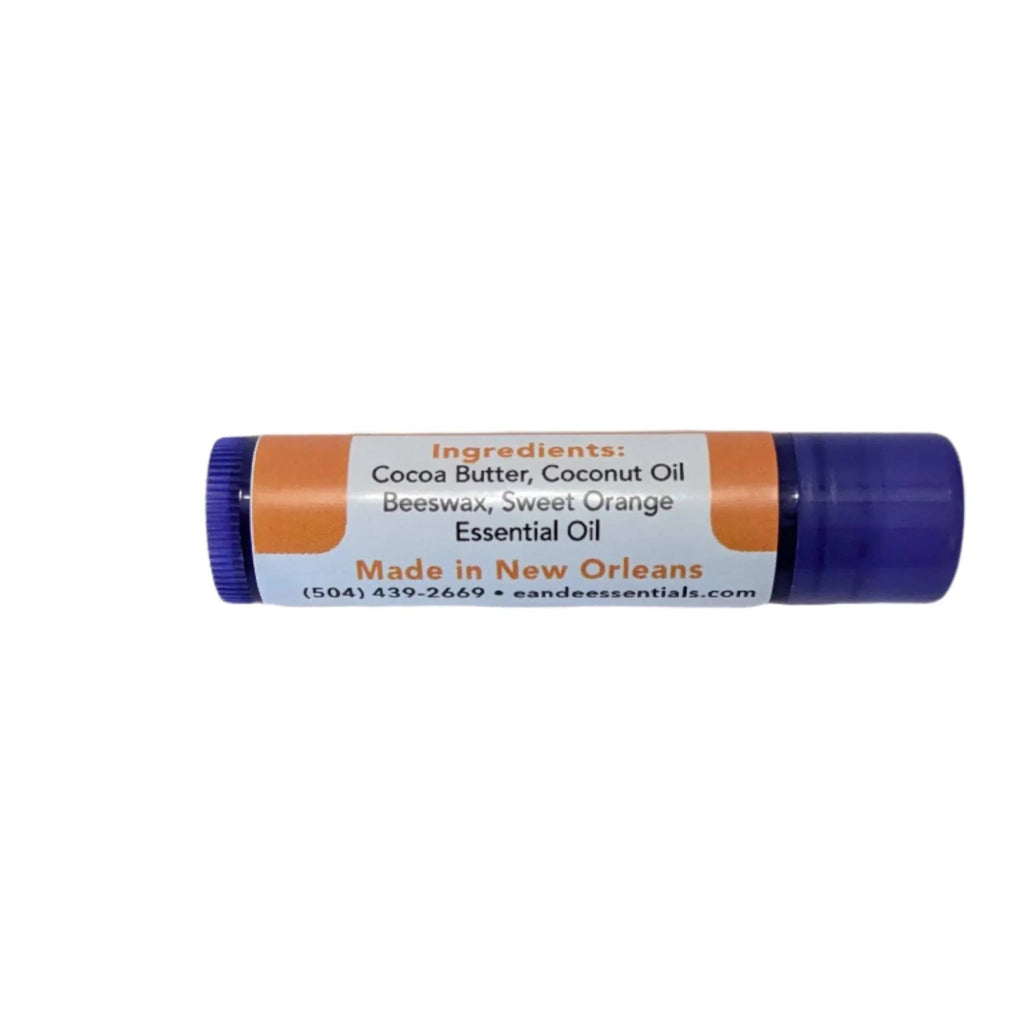 Sweet Orange Lip Balm tube with natural ingredients like cocoa butter, coconut oil, and sweet orange essential oil.