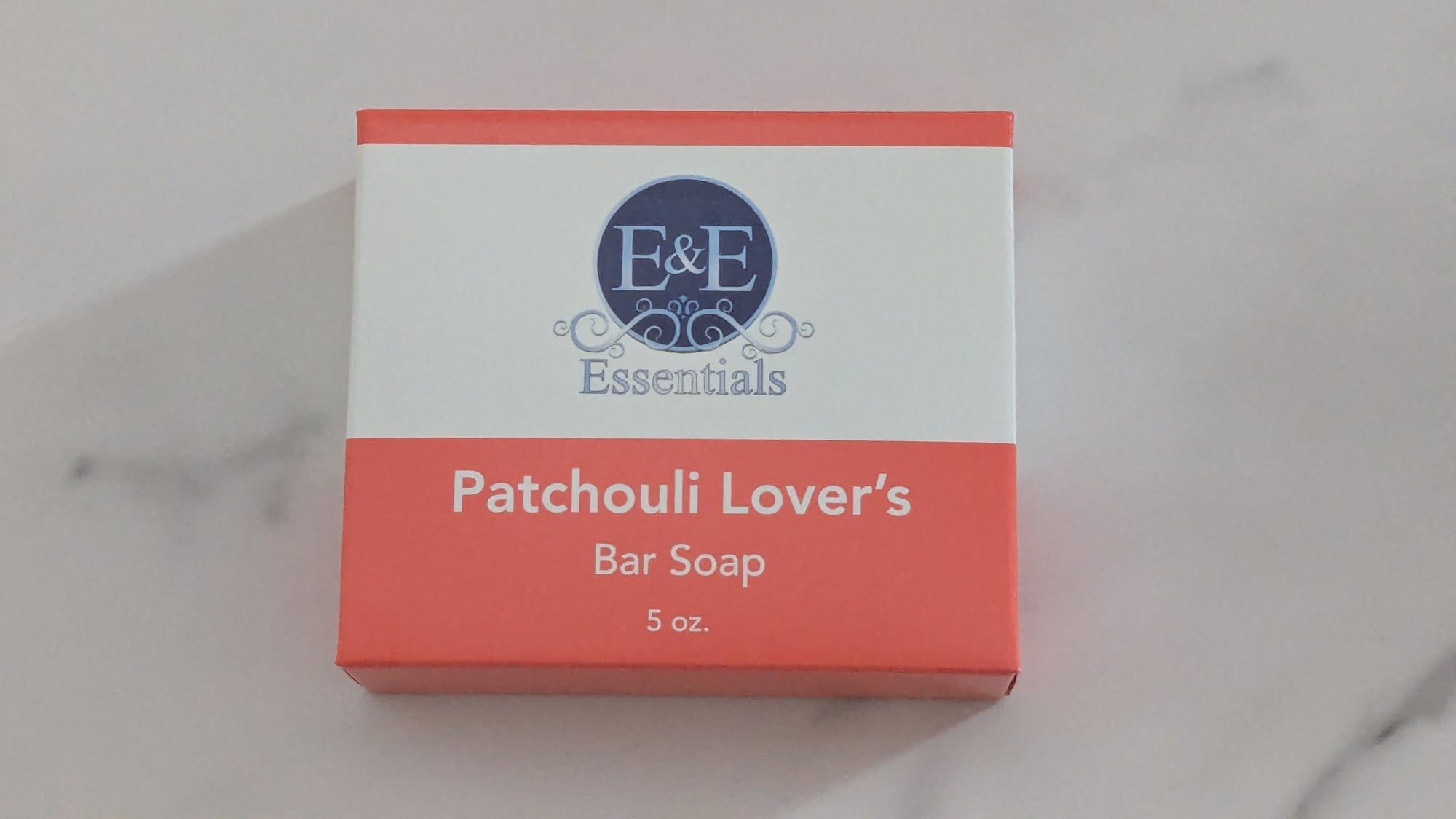 Box of E&amp;E Essentials Patchouli Lover's Bar Soap on a marble surface